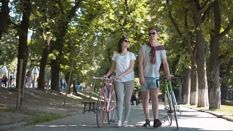 Friends Talking While Walking Stockbeeldmateriaal 91794339