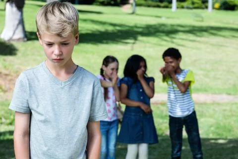 Friends teasing a boy Stock Photos