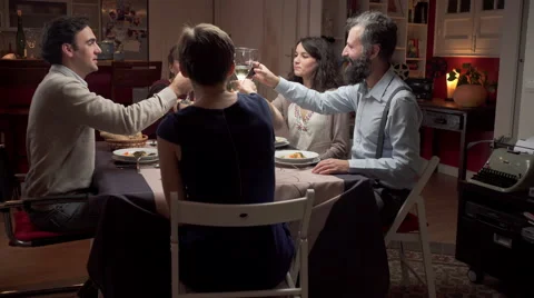 Friends toast at dinner Видео 46517419