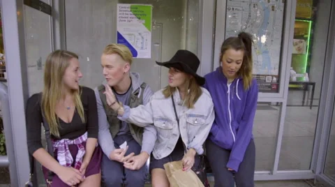 Friends wait at the bus station Stock Footage 54098005