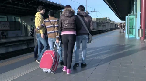 Friends welcome him to the train station Stock-Footage 34273531