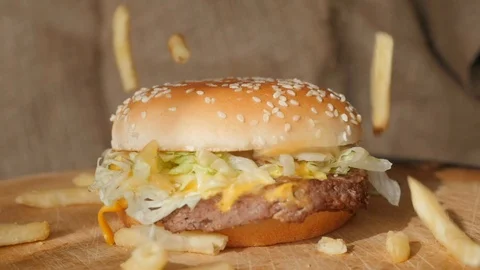 Fries falling on the hamburger, burger, slow motion 스톡 동영상 126027602
