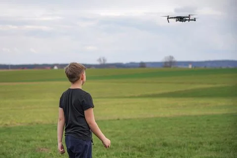 A frightened boy got stressed when he saw a quadcopter in the field. Photos