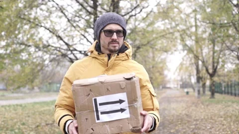 Frightened delivery worker giving broken customer parcel, shipment accident Stock Footage 220792115