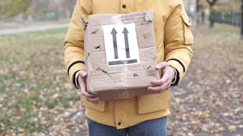 Frightened delivery worker giving broken customer parcel, shipment accident Video stock 220792718
