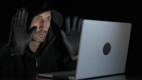 Frightened hacker at the computer. Stock Footage 121565176