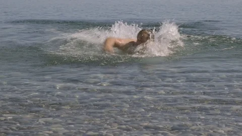 Frightened man escapes from a shark when swimming in the sea. Stock Footage 120578429