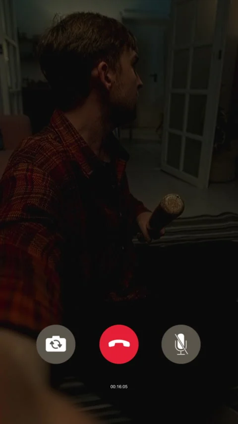 Frightened Man Video Calling with Bat in Hand in Empty House at Night 스톡 동영상 311566523