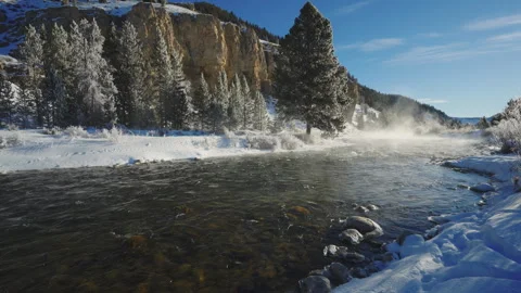 Frigid Winter Creek Flows Through Snowy Valley Stock Footage 301014890