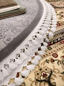Fringe on a carpet edge highlighting quality craftsmanship and elegant text.. Stock Photos