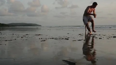 Frisbee game on beach in slow motion Stock Footage 61140018