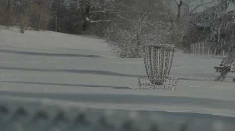 Frisbee golf basket surrounded by fresh snow Stock Footage 35510420