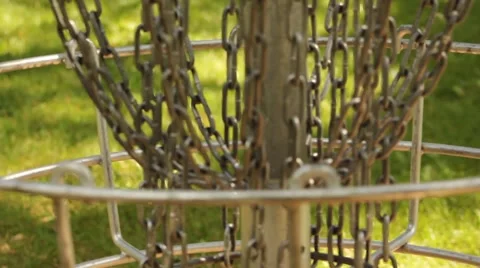 Frisbee Golf Disc Lands in Chains Super Close Up Stock Footage 52789937