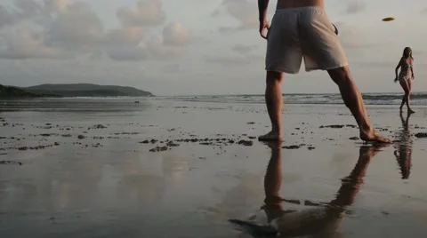 Frisbee by ocean in slow motion Stock Footage 61140014