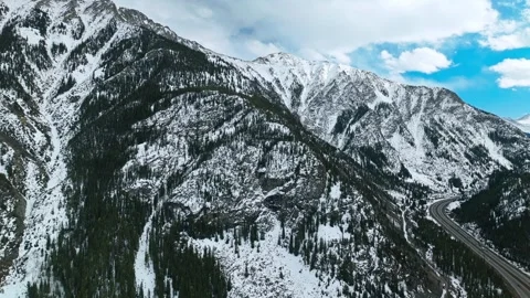 Frisco Gulch steep mountain slopes with snow patches and forest 動画素材 334660346