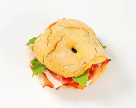 Friselle roll with prosciutto Stock Photos