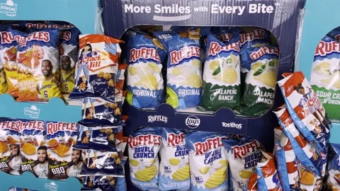 Frito Lay chips and Cracker Jack Jill display in a grocery store Stock Footage 233912828