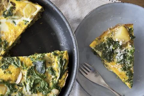 Frittata in Pan with Slice Stock Photos