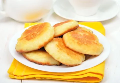 Fritters on white plate Stock Photos