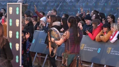 Frog-like performers at the red carpet event of 72nd British Academy Film Awards Video stock 103670218