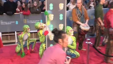 Frog-like performers at red carpet event of 72nd EE British Academy Film Awards Stock Footage 103670330