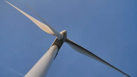 Frog perspective of wind turbine in action Stock Footage 93341353