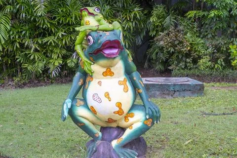 Frog statue with a frog on top of it Stock Photos