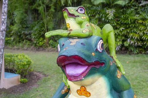 Frog statue with a frog on top of it Stock Photos