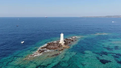 Front aerial shot approaching the lighthouse on the coast of Sardinia Stock Footage 115433260