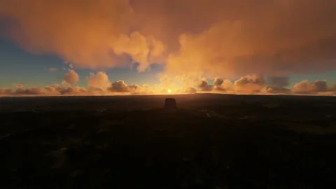 Front aerial view of Devils Tower at sunset in Wyoming. United States Vídeo Stock 201402954