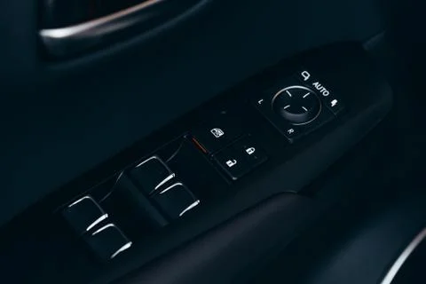 Front and back electric windows buttons-lower or close car windows. Leather u Stock Photos