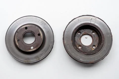 Front and back view of old rusty brake discs Stock Photos