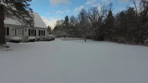 Front and Back Yard Aerial View During the Winter Stock Footage 74664966