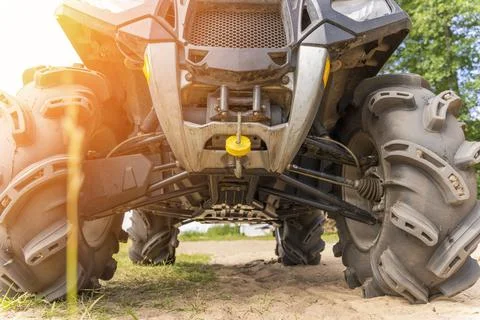 Front and bottom view of the ATV standing on sandy ground Foto stock