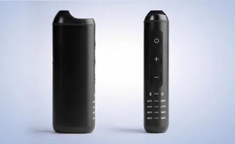 Front and side view of black modern electronic herb vaporizer on blue backgro Stock Photos
