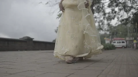 Front angle of an Indian Bride walking with shoes and meets his partner Video stock 325432572