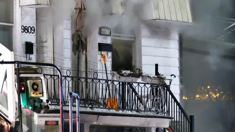 Front of apartment building on fire with shovel and balcony Stock Footage 105288402