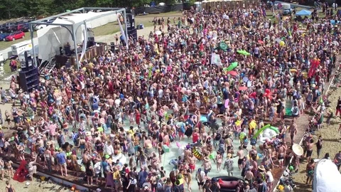 Front to back slide of forest pool party Video stock 78390039