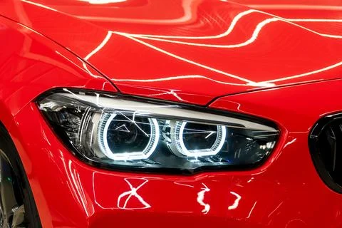 Front BI-LED headlight on a red sport car. Stock Photos