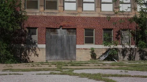 The front of a boarded up building Stock Footage 79333820