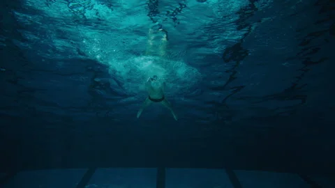 Front bottom view of a man swimmer Stock Footage 283138635