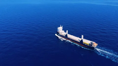 Front bow view of a cargo ship cutting through water in the open sea. Stock Footage 336227039
