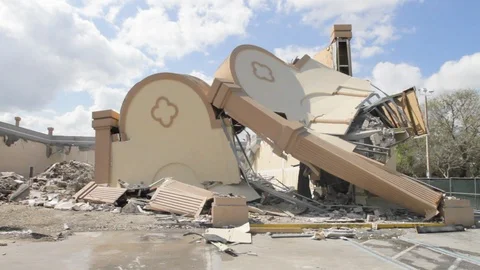 Front of building collapses and falls at construction demolition Stock Footage 125055926