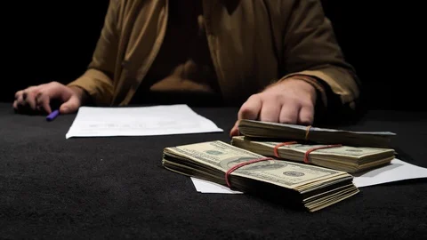 In front of a businessman throwing a pack of dollars close up. Stock Footage 129786640