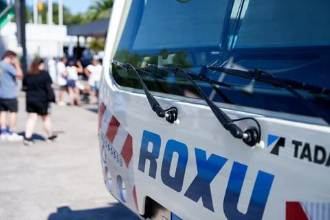 Front cab of white and blue Roxu branded heavy crane truck Stock Photos