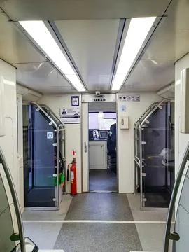 The front cabin of a passenger train attached to the empty train driver's cabin Fotos de archivo