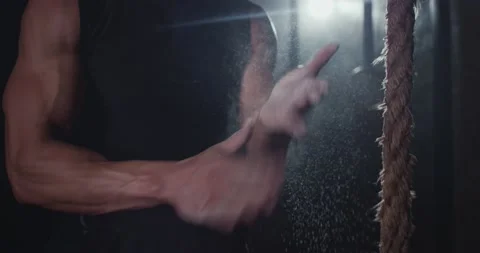 In front of the camera athletic guy start doing his workout program take some Stock Footage 138111502