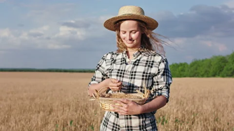 In front of the camera attractive country side lady with a long curly hair and Stock Footage 136369946
