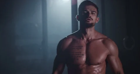 In front of the camera charismatic guy with a brutal face after his workout Stock Footage 118604730