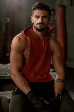 In front of the camera charismatic guy with a brutal face after his workout Stock Photos